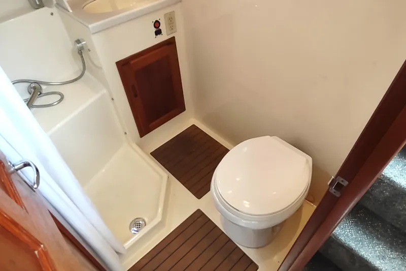 Bernardi Yacht Photos Pics Bathroom interior of 2004 Nordic Tug 32, featuring toilet and shower area.