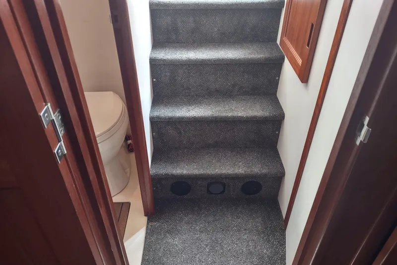 Bernardi Yacht Photos Pics Interior stairs and bathroom of a 2004 Nordic Tug 32 boat.