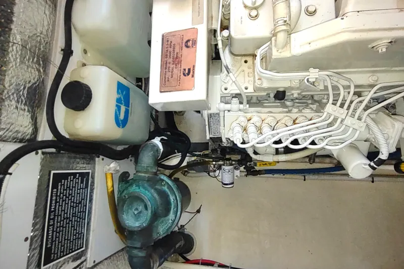 Bernardi Yacht Photos Pics Engine room of a 2004 Nordic Tug 32, showcasing mechanical components and wiring.