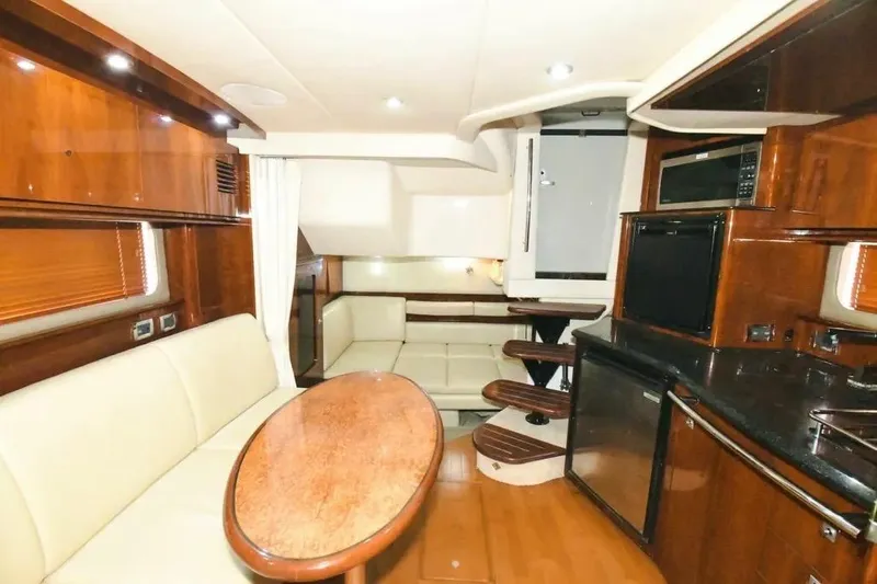  Yacht Photos Pics Luxurious interior of 2010 Sea Ray 390 Sundancer yacht with elegant wood finishes.