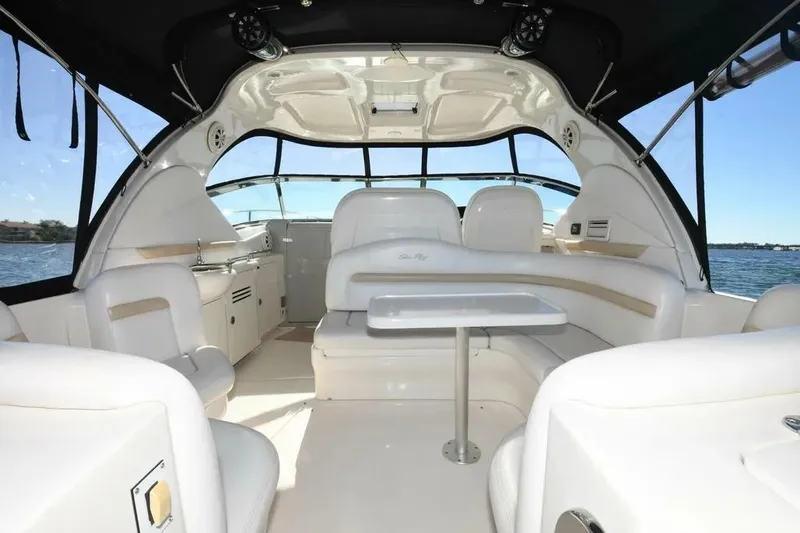  Yacht Photos Pics Luxurious interior of 2010 Sea Ray 390 Sundancer yacht with seating and table.
