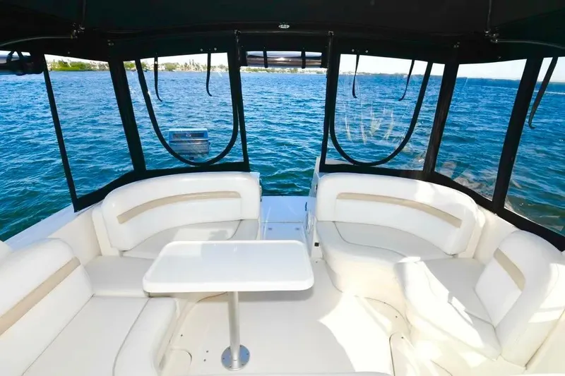  Yacht Photos Pics Luxurious 2010 Sea Ray 390 Sundancer yacht interior with white seating and ocean view.
