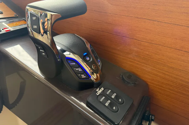  Yacht Photos Pics Control panel of 2025 Ranger Tugs R-27 boat with throttle and trim buttons.