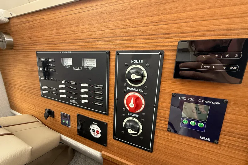  Yacht Photos Pics Control panel of 2025 Ranger Tugs R-27 boat with switches and DC-DC charger.