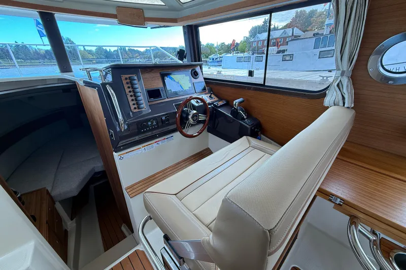  Yacht Photos Pics Interior of 2025 Ranger Tugs R-27 boat with modern helm and navigation equipment.