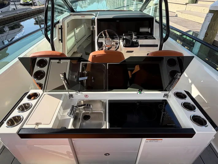  Yacht Photos Pics Interior of Saxdor 320 GTO 2025 featuring modern kitchen and helm area.