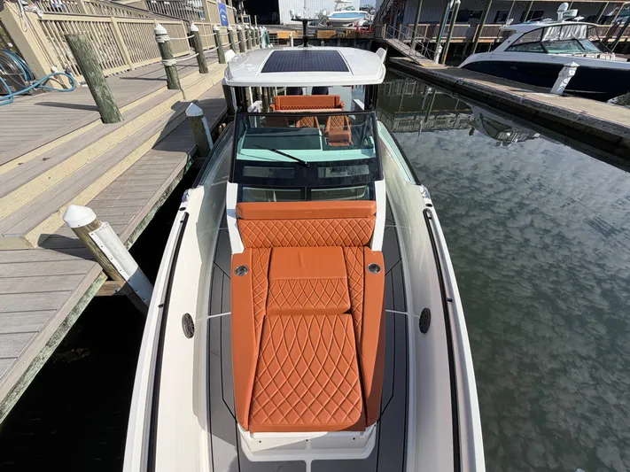  Yacht Photos Pics Saxdor 320 GTO 2025 with luxurious orange seating at the dock.