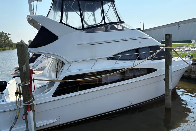 Elevate Yacht Photos Pics 2003 Carver 360 Sport Sedan docked at marina, side view.