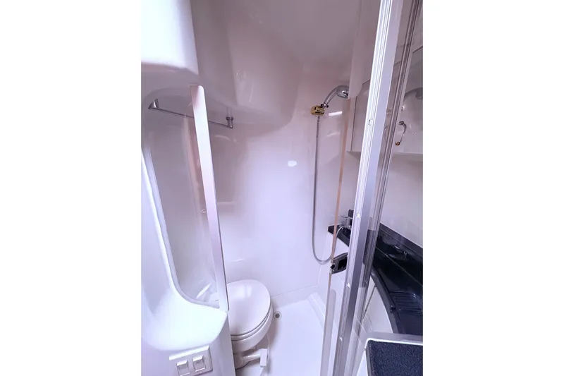 Elevate Yacht Photos Pics 2003 Carver 360 Sport Sedan bathroom with shower, toilet, and sink.
