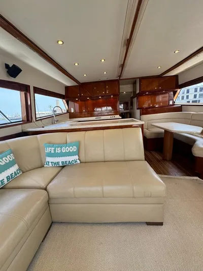 Spill Yacht Photos Pics Interior of 2007 Bertram 510 Convertible yacht with leather seating and wooden cabinetry.