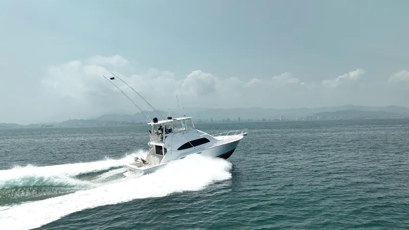 Spill Yacht Photos Pics Bertram 510 Convertible 2007 yacht cruising on open water.