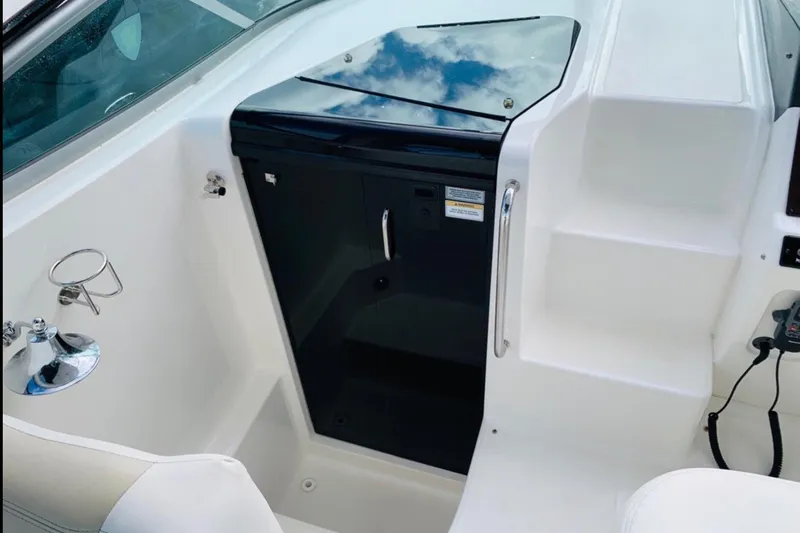  Yacht Photos Pics 2011 Sea Ray 310 Sundancer cockpit with steps and storage compartment.