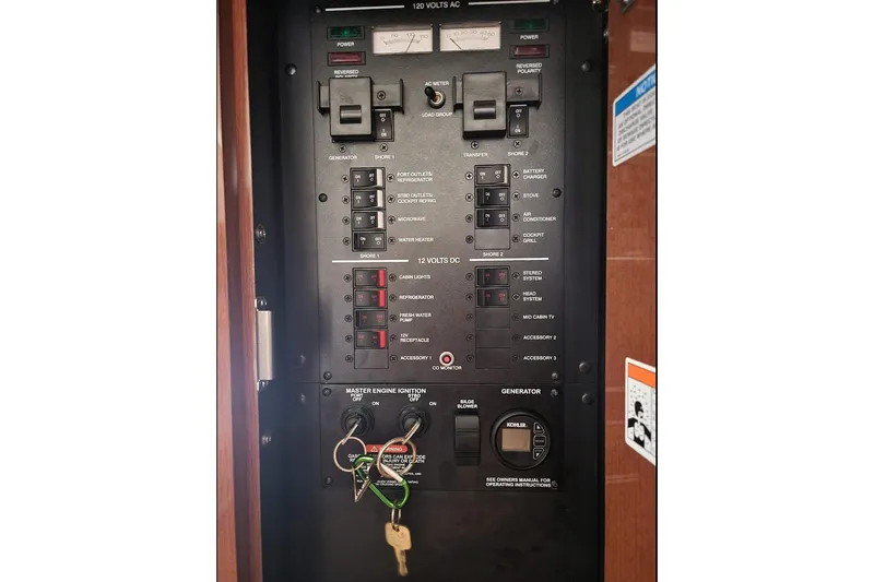  Yacht Photos Pics Electrical control panel of 2011 Sea Ray 310 Sundancer boat with switches and keys.