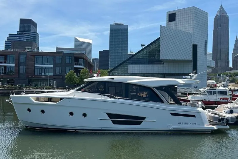 Scotts N Water Yacht Photos Pics 2024 Greenline 45 Coupe Hybrid yacht docked in urban marina with city skyline.