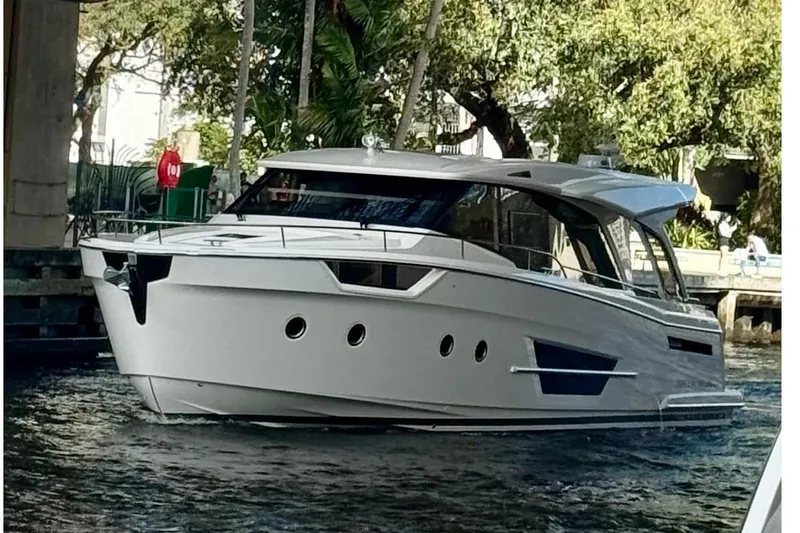 Scotts N Water Yacht Photos Pics 2024 Greenline 45 Coupe Hybrid yacht cruising on a scenic waterway.