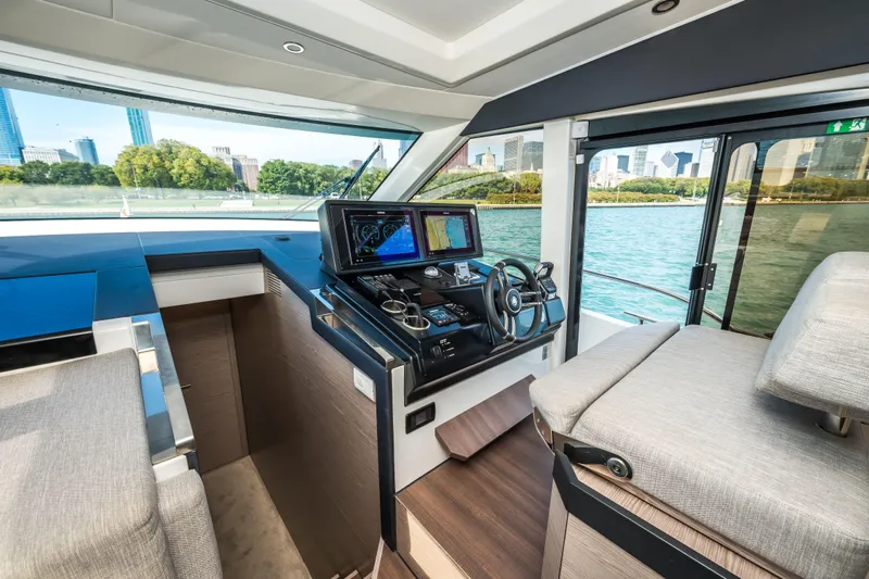 Scotts N Water Yacht Photos Pics 2024 Greenline 45 Coupe Hybrid yacht interior with modern helm and cityscape view.