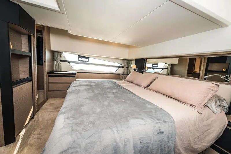 Scotts N Water Yacht Photos Pics Luxurious bedroom interior of 2024 Greenline 45 Coupe Hybrid yacht, featuring elegant design.