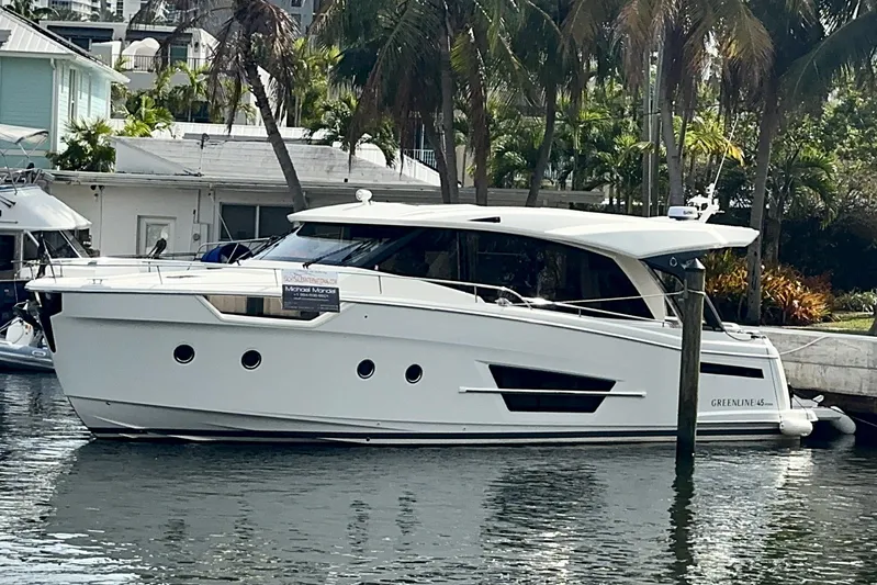 Scotts N Water Yacht Photos Pics 2024 Greenline 45 Coupe Hybrid yacht docked by palm trees.