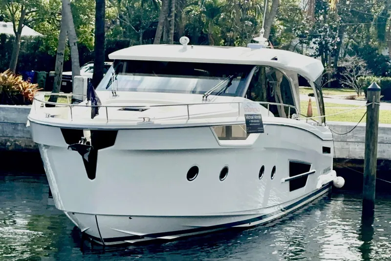 Scotts N Water Yacht Photos Pics 2024 Greenline 45 Coupe Hybrid yacht docked in a serene marina setting.