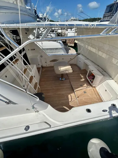  Yacht Photos Pics 2007 Riviera 47 Convertible yacht with spacious deck and seating area, docked at marina.