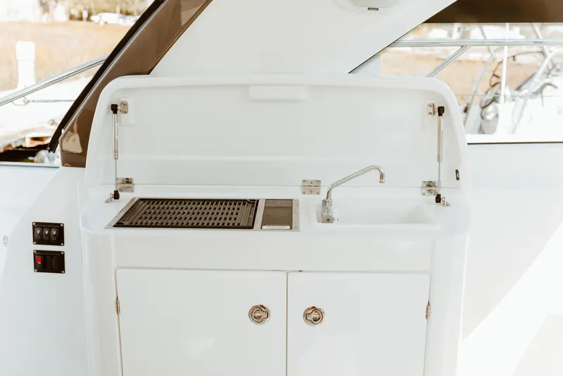 Yacht Photos Pics 2023 Beneteau Gran Turismo 41 yacht kitchenette with sink and grill.