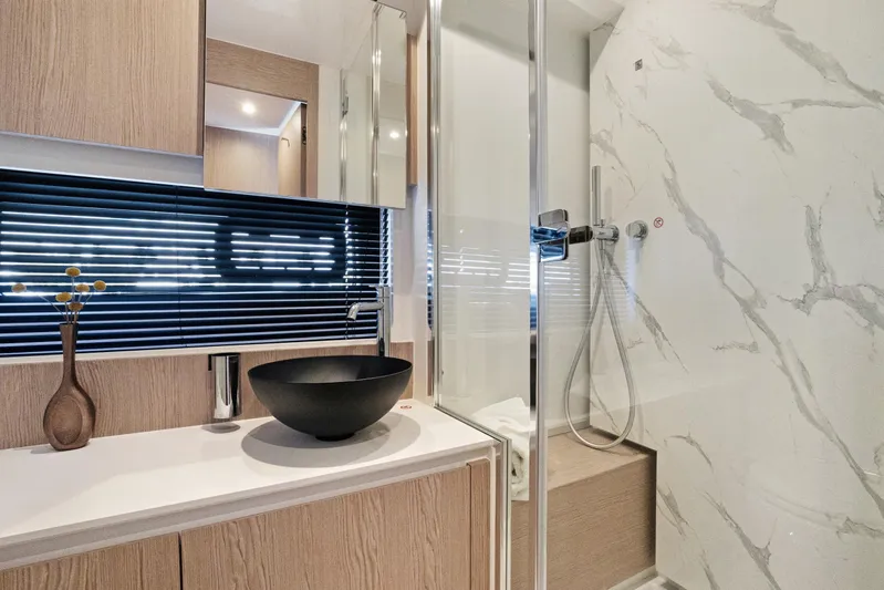 Guyal Yacht Photos Pics Luxurious bathroom in 2024 Azimut Fly 53 yacht with modern fixtures and elegant design.