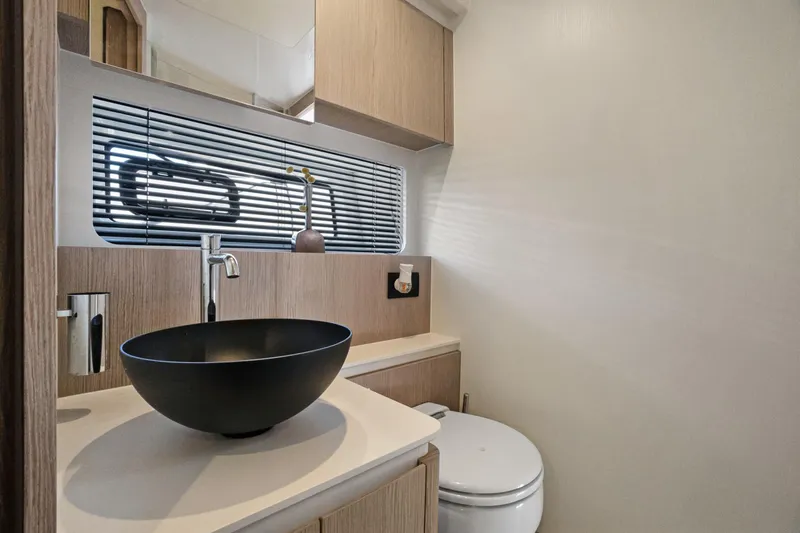 Guyal Yacht Photos Pics Modern bathroom interior of 2024 Azimut Fly 53 yacht with sleek black basin.
