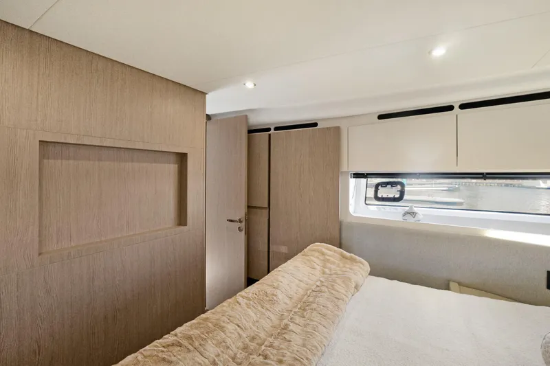 Guyal Yacht Photos Pics Luxurious interior of 2024 Azimut Fly 53 yacht bedroom with modern design and natural light.