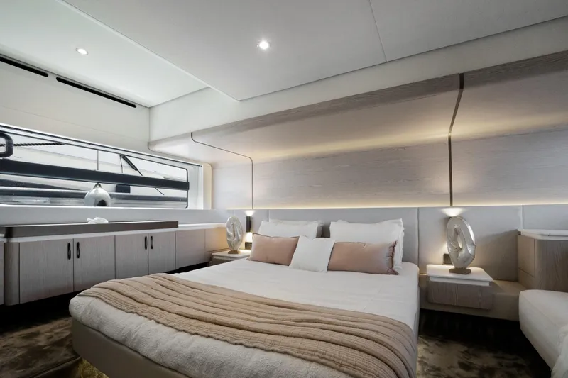 Guyal Yacht Photos Pics Luxurious bedroom interior of 2024 Azimut Fly 53 yacht, featuring modern design and elegant lighting.