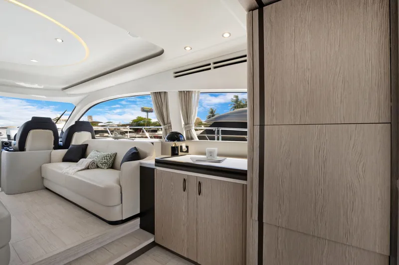 Guyal Yacht Photos Pics Luxurious interior of 2024 Azimut Fly 53 yacht with modern furnishings and panoramic windows.