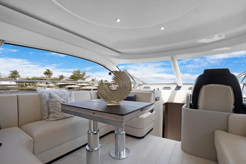 Guyal Yacht Photos Pics Luxurious interior of 2024 Azimut Fly 53 yacht with elegant seating and decor.