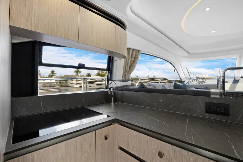 Guyal Yacht Photos Pics Luxurious interior of 2024 Azimut Fly 53 yacht with modern kitchen design.