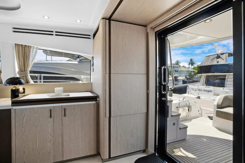 Guyal Yacht Photos Pics Interior view of 2024 Azimut Fly 53 yacht, featuring modern design and outdoor access.