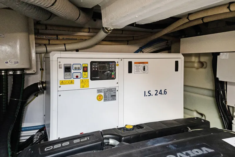 Guyal Yacht Photos Pics Engine room of 2024 Azimut Fly 53 yacht, featuring generator and piping system.