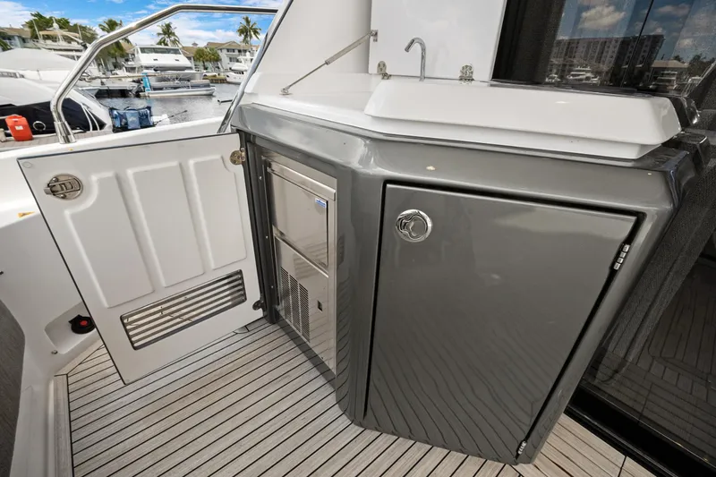 Guyal Yacht Photos Pics 2024 Azimut Fly 53 yacht kitchenette with sink and storage, docked at marina.