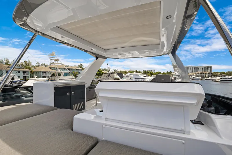 Guyal Yacht Photos Pics 2024 Azimut Fly 53 yacht deck with modern seating and marina view.