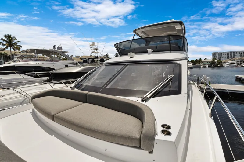 Guyal Yacht Photos Pics 2024 Azimut Fly 53 yacht docked at marina under blue sky.
