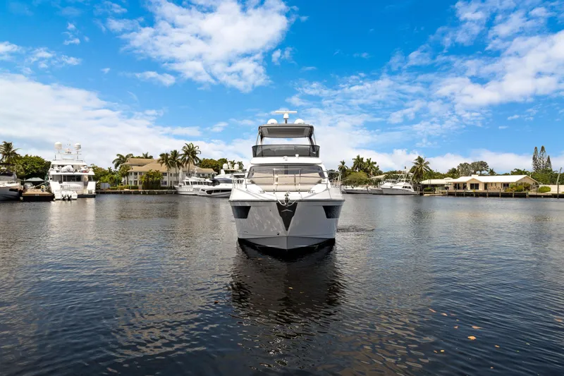 Guyal Yacht Photos Pics 2024 Azimut Fly 53 yacht on calm water with blue sky background.