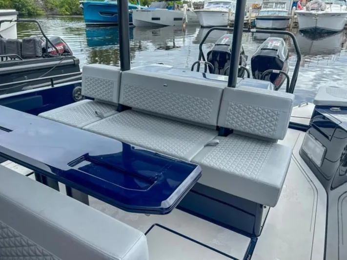  Yacht Photos Pics 2024 BRABUS Shadow 1000 ST luxury boat interior with seating and table.