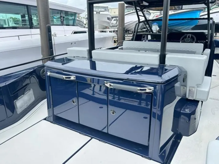  Yacht Photos Pics 2024 BRABUS Shadow 1000 ST luxury yacht interior with sleek blue cabinetry.