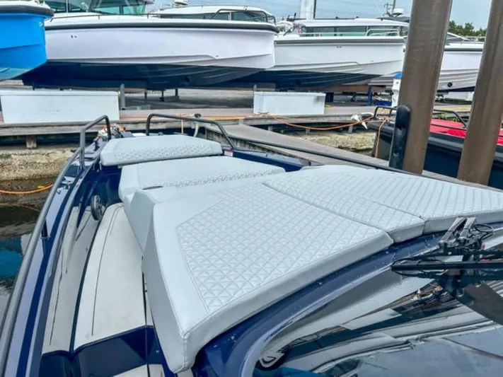  Yacht Photos Pics 2024 BRABUS Shadow 1000 ST luxury boat with cushioned deck at marina.