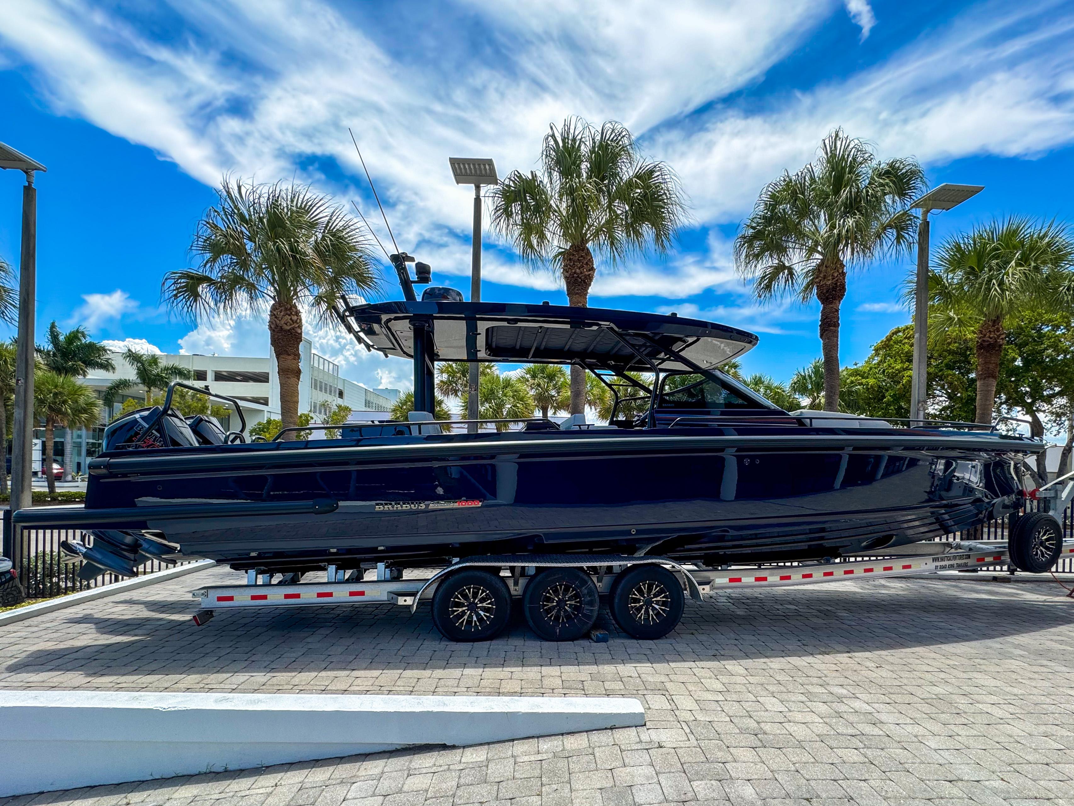 2024 BRABUS Shadow 1000 ST boat on trailer, surrounded by palm trees.