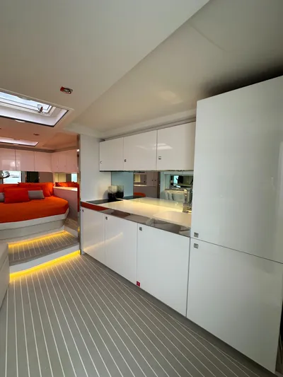  Yacht Photos Pics Luxurious interior of a 2018 VanDutch 55 yacht with modern kitchen and cozy bedroom.