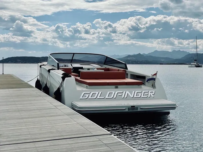  Yacht Photos Pics VanDutch 55 yacht named "Goldfinger" docked by a serene waterfront, 2018 model.
