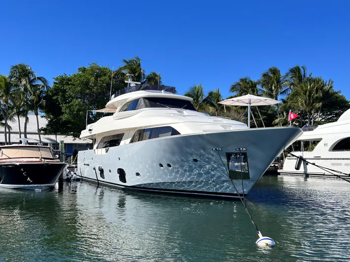 Slainte III Yacht Photos Pics Luxurious 2013 Custom Line Navetta yacht docked in a sunny marina.