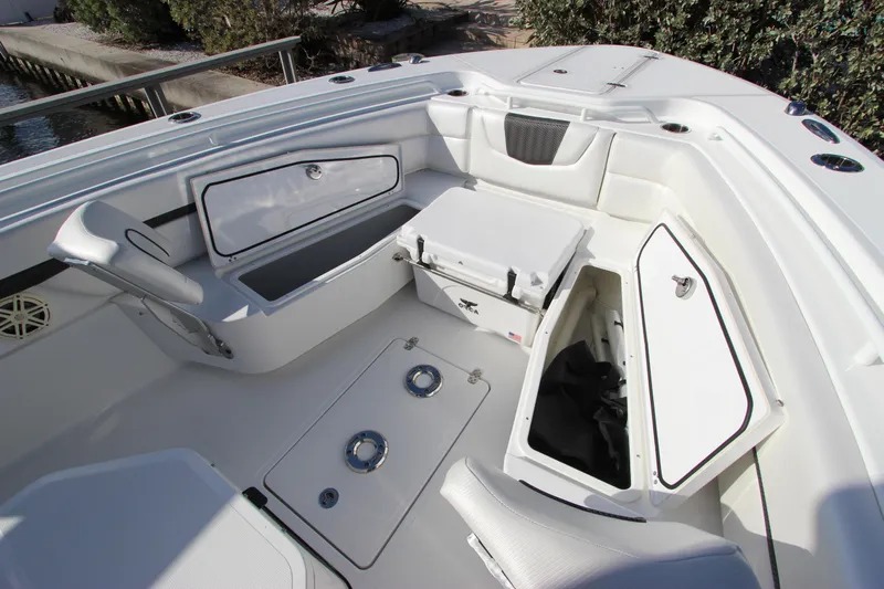  Yacht Photos Pics 2020 Wellcraft 302 Fisherman boat interior with storage compartments and seating.