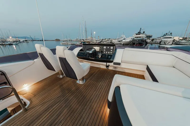  Yacht Photos Pics Luxurious 2014 Princess S72 yacht deck with elegant seating and marina view.