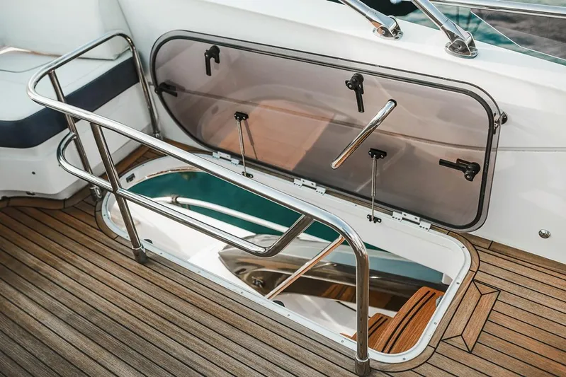  Yacht Photos Pics Hatch on 2014 Princess S72 yacht with wooden deck and stainless steel railing.
