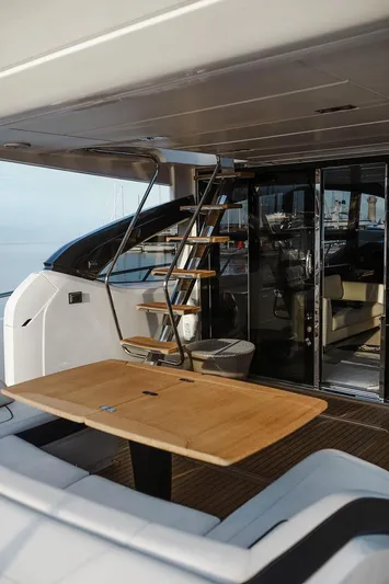  Yacht Photos Pics Luxury yacht Princess S72, 2014 model, featuring elegant outdoor seating and staircase.