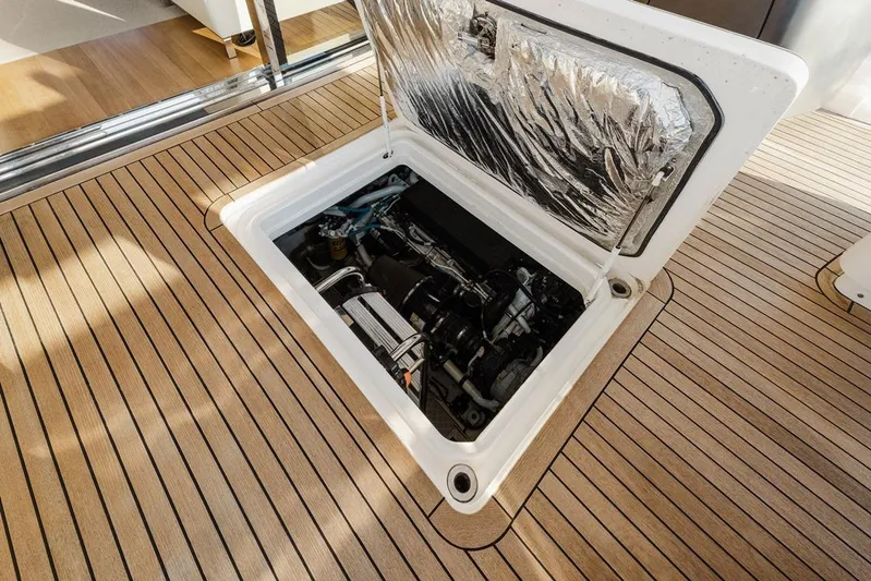  Yacht Photos Pics Engine compartment of a 2014 Princess S72 yacht with open hatch on teak deck.
